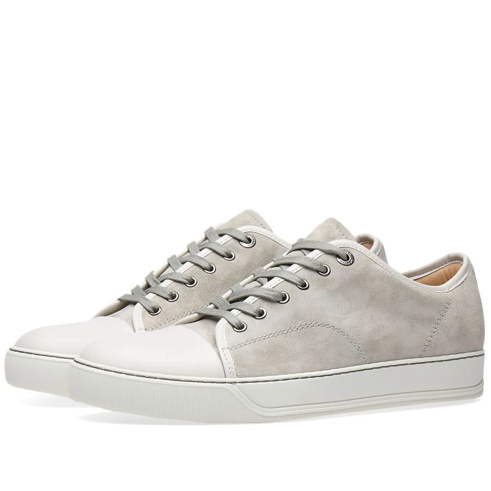 Lanvin sneakers with toe cap and cement colorway.